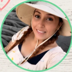 Ms. Tammy smiling in a sun hat
